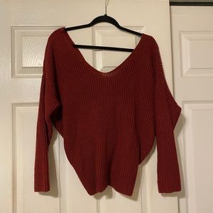 Red sweater with twisted back